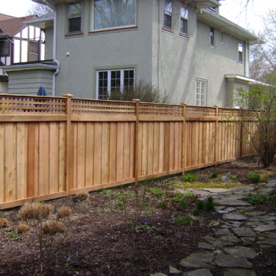 Photo of a traditional fence with a lattice topper designed and installed by First Fence Company