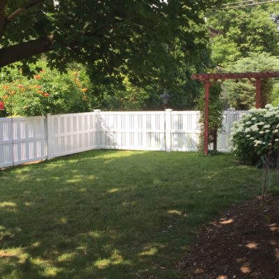 Photo of a 4 foot white moline PVC/Vinyl fence installed by First Fence Company