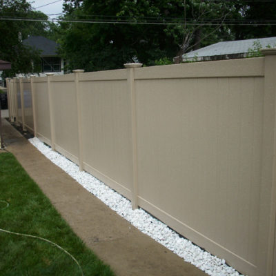 Photo of a tan Adobe Peru PVC/vinyl fence designed and installed by First Fence
