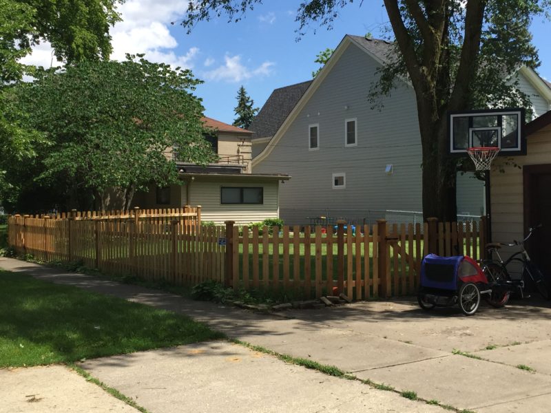 Photo of a picket wood fence installed by First Fence Company