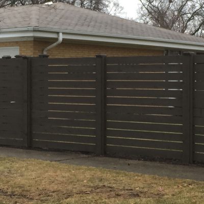 Photo of a custom horizontal pre-stained fence installed by First Fence