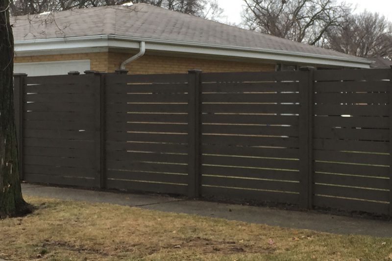 Photo of a custom horizontal pre-stained fence installed by First Fence