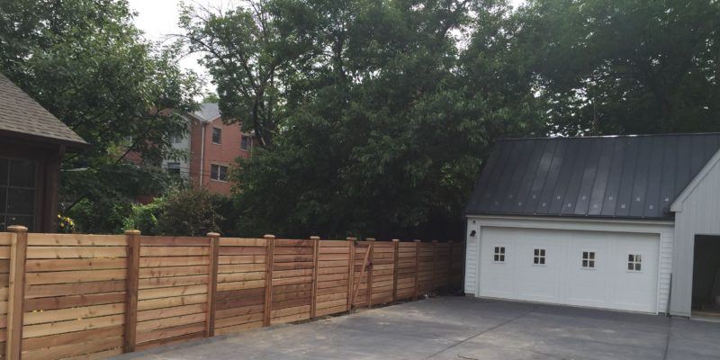 Photo of a custom horizontal wood fence at a modern farmhouse residence installed by First Fence Company