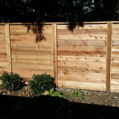 Photo of a custom horizontal wood fence designed and installed by First Fence Company in Hillside, IL