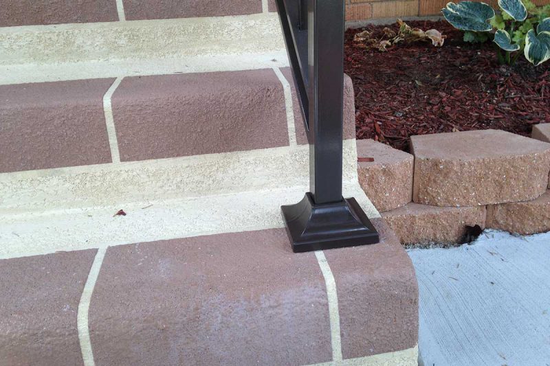 Photo of an iron railing footing - First Fence