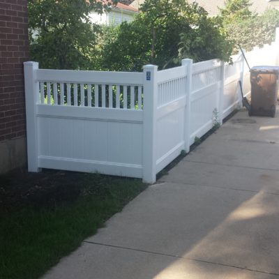 Photo of a 4 foot white Juniper vinyl/PVC fence designed and installed by First Fence