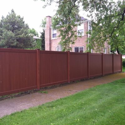 Photo of a Mocha Peru vinyl/PVC fence designed and installed by First Fence